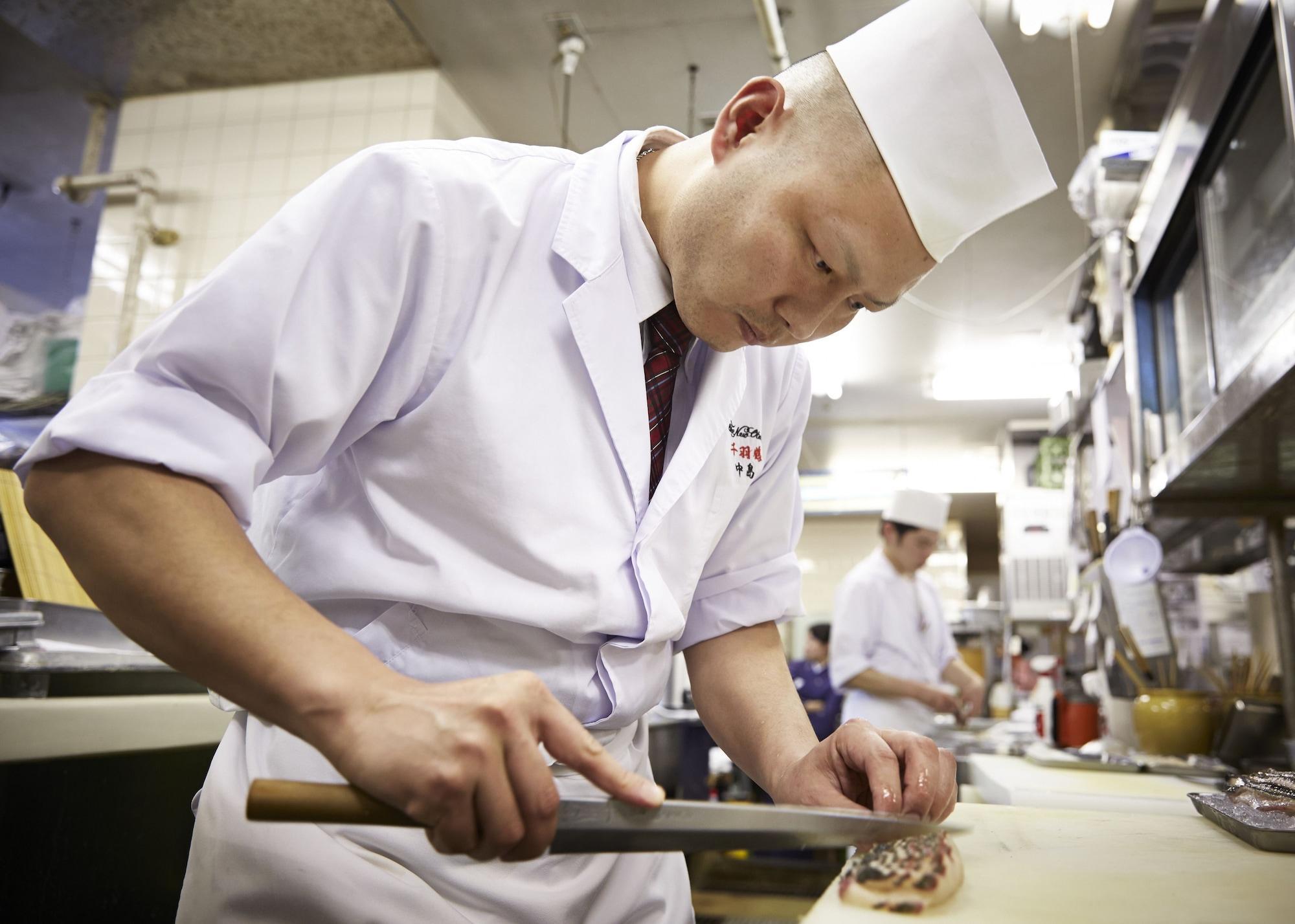 Hotel New Otani Hakata Φουκουόκα Εξωτερικό φωτογραφία A cook working in a restaurant kitchen